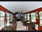 Seating area in the “Grinsteade Buffet” coach at the Bluebell Railway.